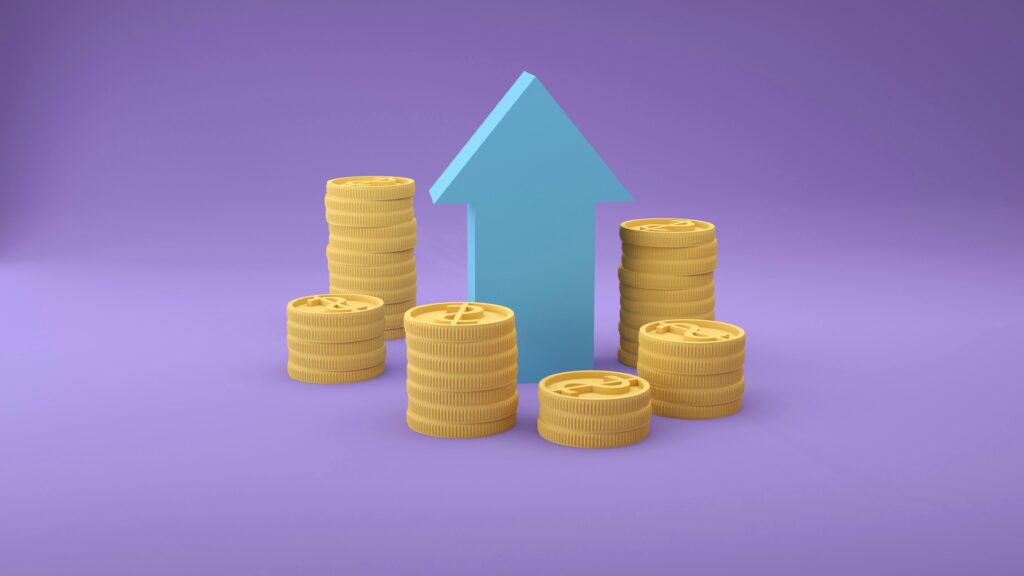 Upward-pointing arrow and stacks of gold coins.