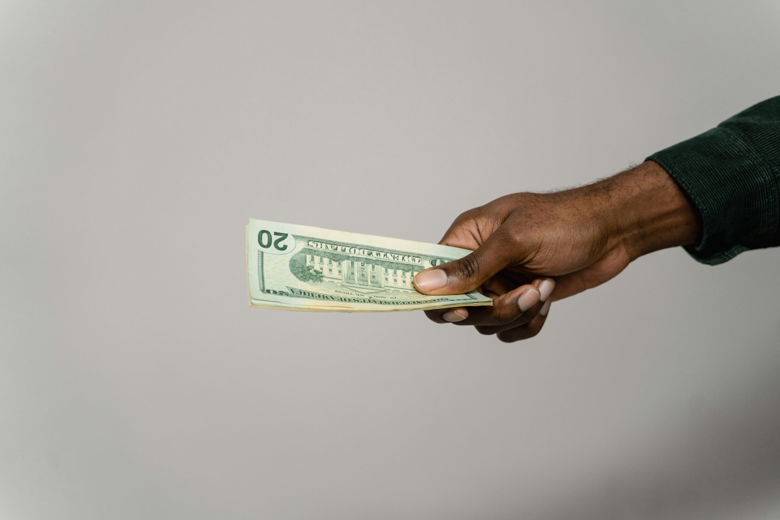 someone handing over cash