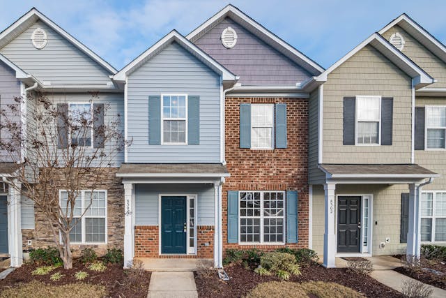 duplexes with blue sky and lawns