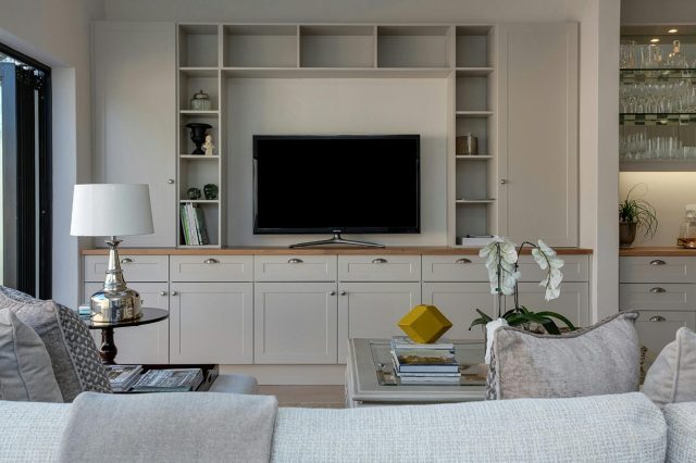 white living room with a TV